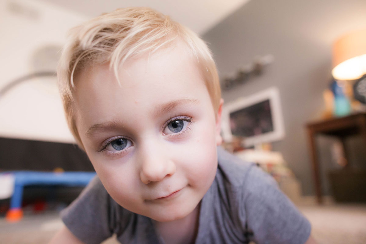 blonde child looking into camera